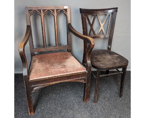 Gothic style chair, the back with carved pierced tri panel back, above open shaped arms and cushioned upholstered seat, raise