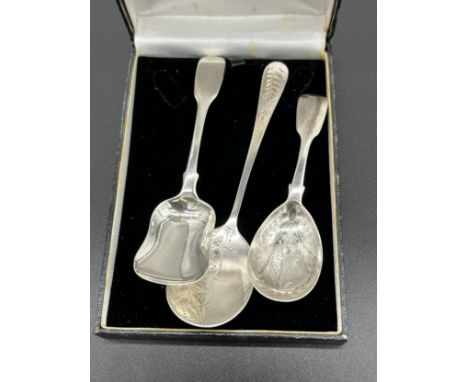 Two Georgian London silver caddy spoons together with a Birmingham silver condiment spoon. [57.33grams]