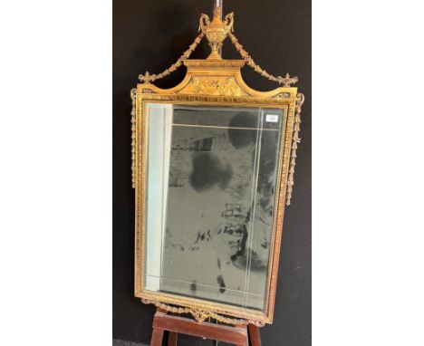 Antique mirror with moulded gilt frame, surmounted by a trophy and flanked by a trailing chain design  [118x62cm] 