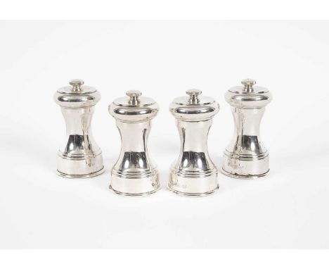 A set of four silver pepper mills, Birmingham 1971/1974, 9cm high, total gross weight approximately 663gProvenance: Ombersley