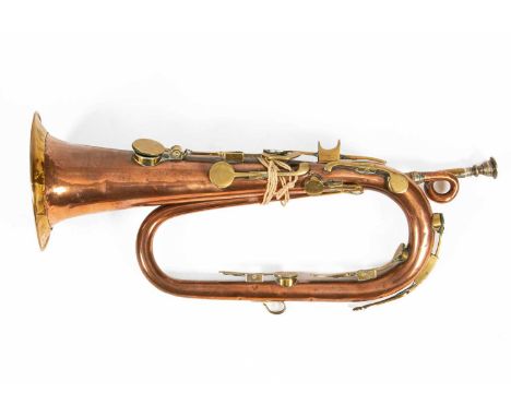 A copper and brass eight-key bugle by Key, 20 Charring Cross, London, 51cm longProvenance: Ombersley Court, WorcestershireGoo