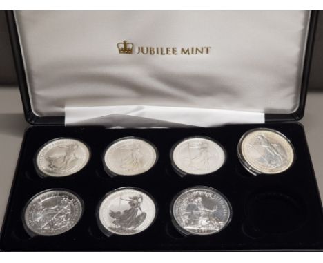 COLLECTION OF 7 DIFFERENT UK ROYAL MINT BRITANNIA SILVER 1OZ COINS 1998 AND 2000-2007 HOUSED IN DISPLAY CASE
