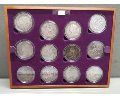 12 UK QUEEN VICTORIA SILVER CROWNS DIFFERENT DATES IN MIXED CIRCULATED GRADES HOUSED IN WOODEN FRAMED DISPLAY
