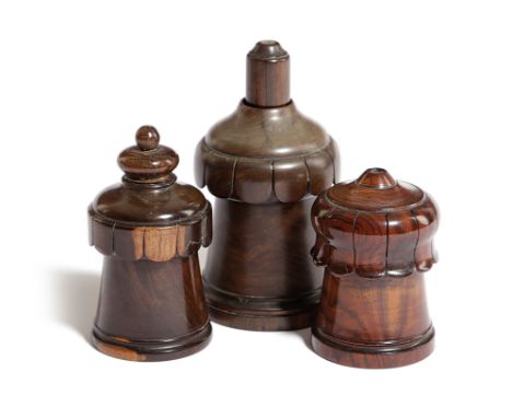THREE TREEN LIGNUM VITAE GO TO BEDS OR VESTA HOLDERS 19TH CENTURY the covers with foliate fringe decoration, around a central