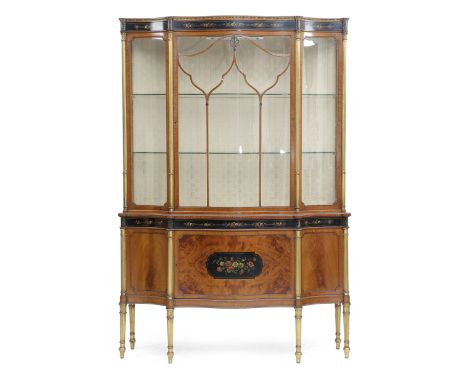 A SHERATON REVIVAL SATINWOOD AND GILTWOOD SERPENTINE DISPLAY CABINET IN THE MANNER OF WRIGHT &amp; MANSFIELD, LATE 19TH CENTU