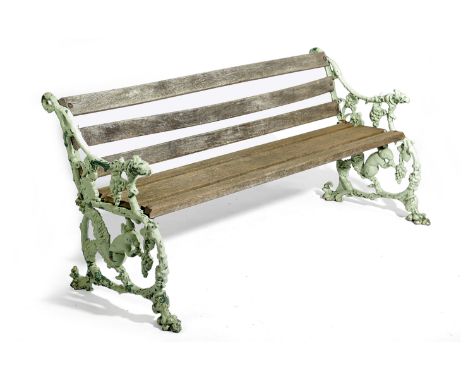 A VICTORIAN CAST IRON AND WOOD GARDEN BENCH IN THE MANNER OF COALBROOKDALE, THIRD QUARTER 19TH CENTURY AND LATER with a later