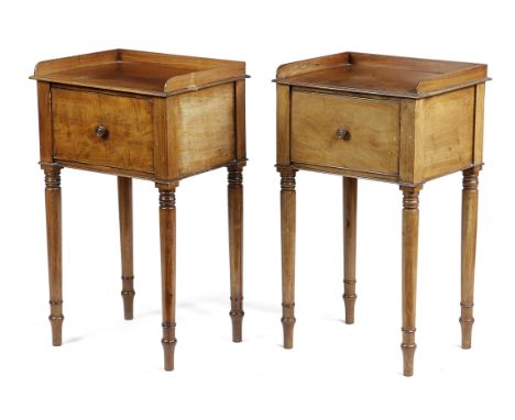 A PAIR OF REGENCY MAHOGANY BEDSIDE CUPBOARDS IN THE MANNER OF GILLOWS, EARLY 19TH CENTURY each with a hinged door, on turned 