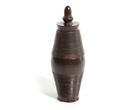 A TREEN LIGNUM VITAE COFFEE GRINDER EARLY / MID-19TH CENTURY of bullet form, in three sections, with an acorn finial revealin