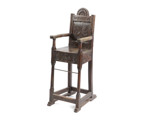 A CHARLES II OAK CHILD'S HIGHCHAIR 17TH CENTURY AND LATER the arched back carved with lunettes and a leaf panel, the apron ca