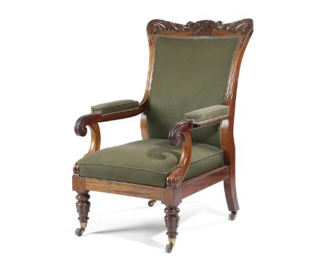 A WILLIAM IV MAHOGANY LIBRARY ARMCHAIR C.1830-35 the frame decorated with carved leaves and lappets, with a drop-in seat, on 