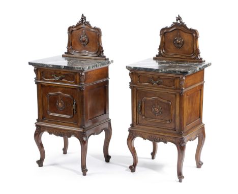 A PAIR OF FRENCH WALNUT BEDSIDE CUPBOARDS EARLY 20TH CENTURY each with a raised back above a black marble top, with a drawer 