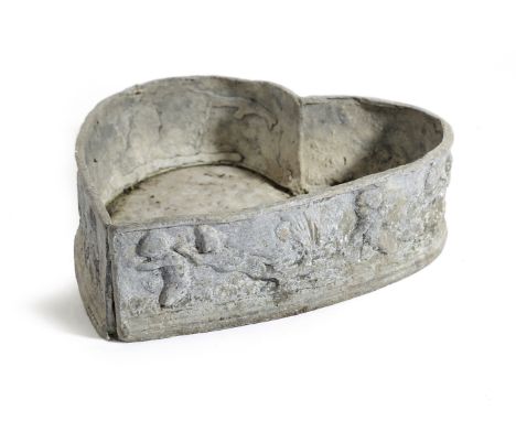 A LEAD HEART SHAPED PLANTER 19TH CENTURY decorated with cherubs 12cm high, 42cm long, 40cm wide