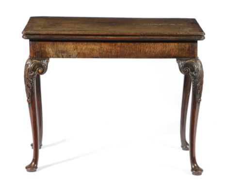 A GEORGE II CONCERTINA ACTION CARD TABLE POSSIBLY PADOUK, C.1740 the fold-over top revealing a baize lined playing surface, o