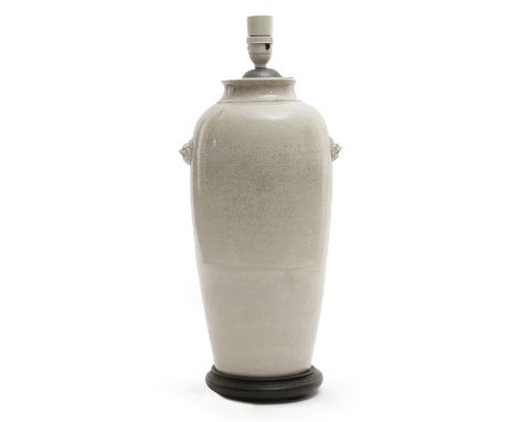 A CHINESE WHITE CRACKLE GLAZE LAMP LATE 19TH / EARLY 20TH CENTURY of slender ovoid form, with a pair of lion's masks, mounted
