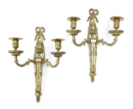 A PAIR OF ORMOLU TWIN-LIGHT WALL LIGHTS IN LOUIS XVI STYLE LATE 19TH CENTURY each with a ribbon and urn backplate (2) 38.4cm 