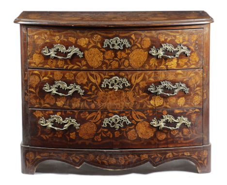 A DUTCH MARQUETRY AND HARDWOOD BOWFRONT COMMODE 19TH CENTURY inlaid with flowers and scrolls and fitted with three long drawe