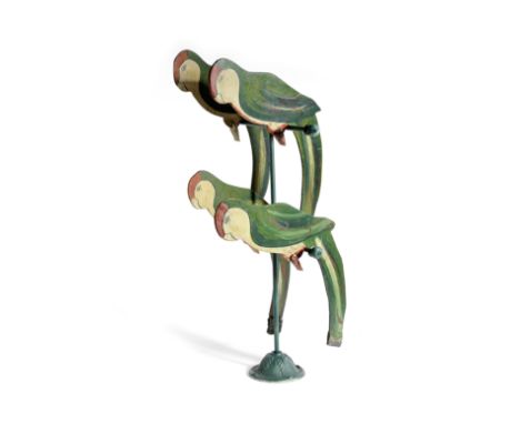A FOLK ART ROCKING PARROT DISPLAY EARLY 20TH CENTURY the four wooden parrots painted in green, white and red, with weighted t