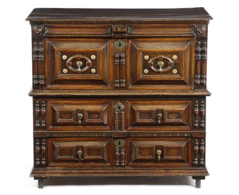 λ A CHARLES II OAK, WALNUT AND SNAKEWOOD CHEST C.1680 in two halves, with applied split mouldings, ivory rondels and cedar mo