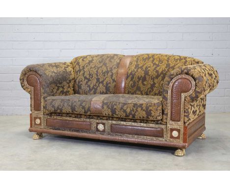 A Versace 'Medusa' two-seater sofa,Italian, upholstered in a brown and gold-coloured foliate fabric, inlaid with crocodile sk