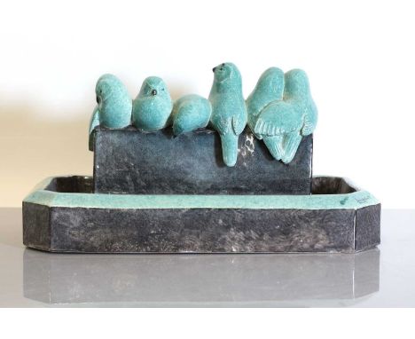 A French Art Deco glazed terracotta centrepiece, modelled as a flock of birds perched on a central plinth, with a water troug