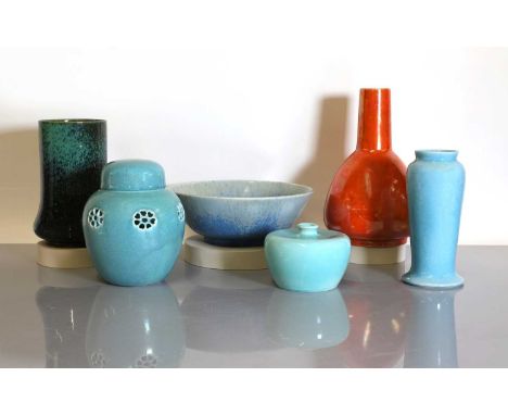 A collection of six Ruskin pottery items,c.1905-30, to include:a light blue lustre potpourri jar and cover, dated '1915', wit