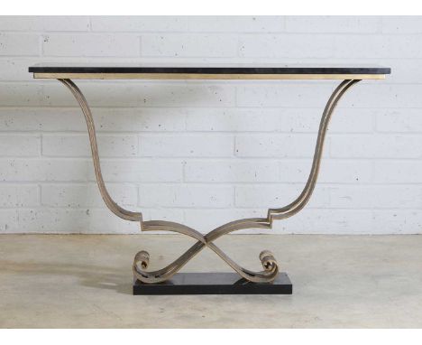 A French Art Deco console table,1940s, in the manner of Raymond Subes, the rectangular black marble top, raised on a scrollin