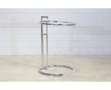 A 'Model E1027' side table, modern, designed by Eileen Gray, with a rise-and-fall circular glass top, 49.5cm diameter77cm hig