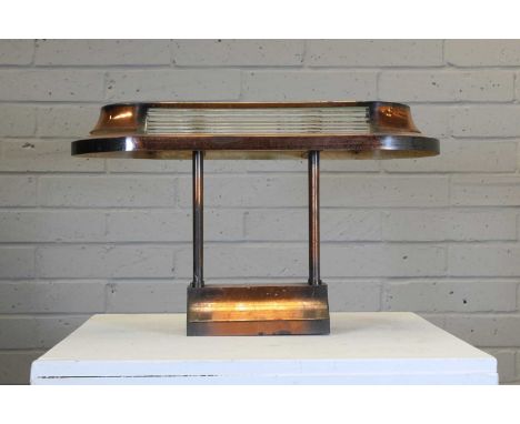 A copper-finished centre light or desk light, with a stepped mount, with four columns, fitted with a rounded rectangular ligh