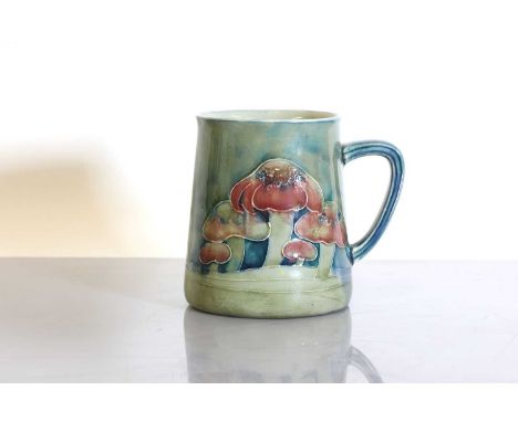 A Liberty &amp; Co. Moorcroft 'Claremont' pottery christening mug,of tapering form, with a green facsimile signature,  9.5cm 