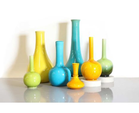 A collection of seven Burmantofts Pottery coloured vases, c.1890, of various bottle forms, in turquoise, yellow and green, va