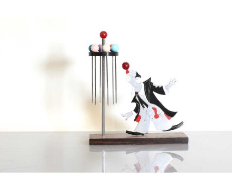 A French Art Deco novelty 'clown' cocktail set,  1930s, probably by Sudre, modelled with a fret-cut clown balancing a ball, w