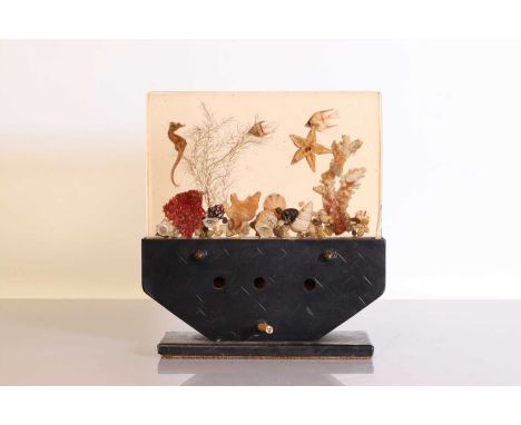 An 'aquarium' Lucite table lamp,1950s, the rectangular panel with fish, a seahorse, coral and shells, the metal mount with ha