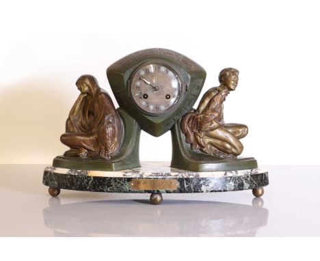 A French Art Deco spelter mantel clock, 'Jour et Nuit', designed by Pierre Sega, the diamond-shaped case flanked on either si