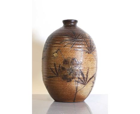 A Martin Brothers' stoneware vase,dated 1884, of ovoid form incised with flowers, with a graduated brown glaze, incised 'Mart