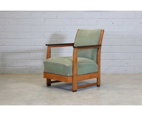 An Art Deco oak and coromandel lounge armchair, attributed to Gordon Russell, with original green velour upholstered back and