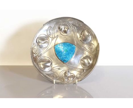 A Liberty Tudric pewter 'Bollelin' dish, designed by Archibald Knox for Liberty &amp; Co., of circular form, cast in relief w