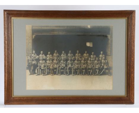 Framed early 20th Century photograph of a Platoon of British Soldiers in Foreign Service uniform, good detail, Slade Wallace 