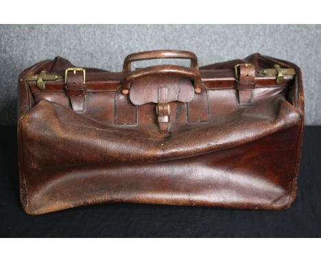 A vintage leather Gladstone bag. H.27 W.60 D.50cm. 
