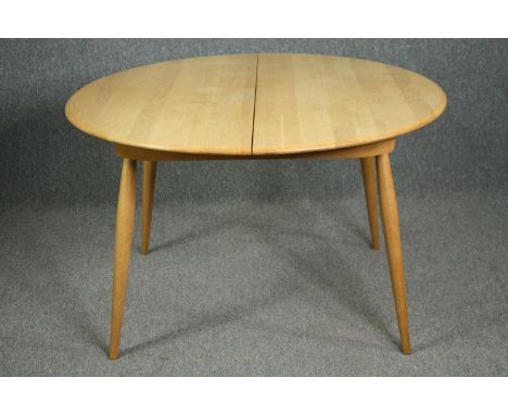 Extending dining table, contemporary light oak and beech Ercol style with integral leaf. H.75 W.165(ext) D.119cm. 