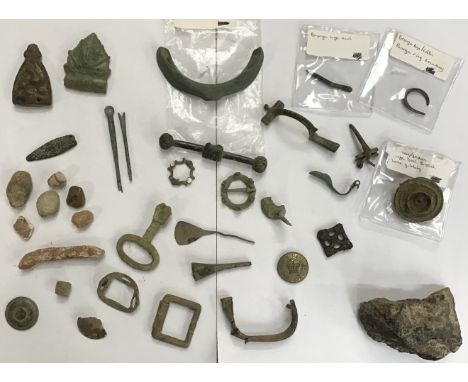 Collection of Metal Detector found Items, including Bronze Age Rowlock (oar holder), Roman Brooches, Medieval Strap Ends and 