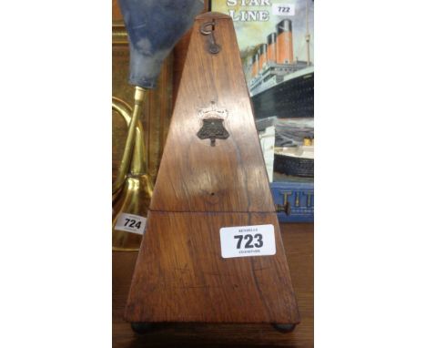 An old rosewood metronome - front cartouche missing