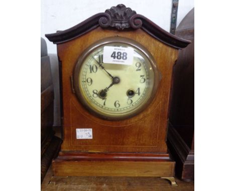 An early 20th Century mahogany and strung cased mantel clock with eight day gong striking movement - no key or pendulum