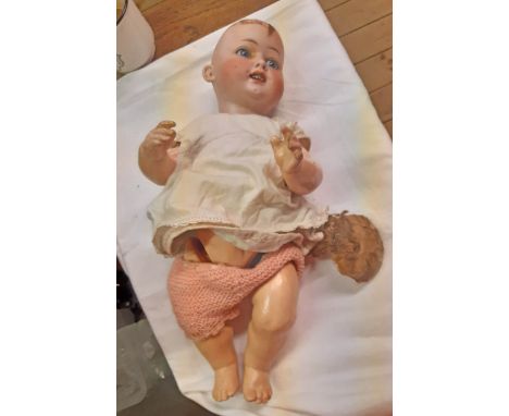 An early 20th Century Heubach Koppelsdorf German porcelain headed doll with composition body and glass eyes - skull cap detac