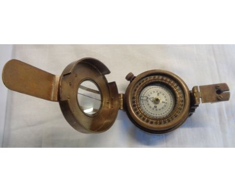 A modern brass hand held compass