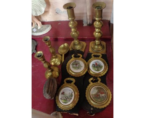 A box containing assorted metalware including brass candlesticks, Ronson table lighter, horse brasses with ceramic bosses, et