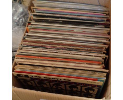 A box containing assorted vinyl LPs including Beatles, Dire Straits, Free, Eagles, Fleetwood Mac, Kate Bush, Bob Dylan, Queen