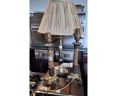 A pair of decorative brass table lamps of Rococo candlestick form - sold with a modern brass table lamp