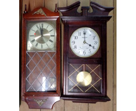 A crate containing a late Victorian black slate cased mantel clock and timepiece, also two modern polished wood cased wall cl