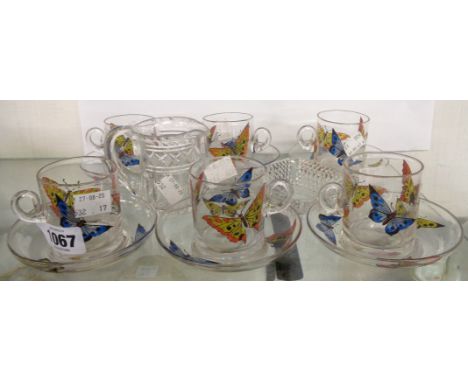 A set of six Stuart glass coffee cans and saucers decorated with coloured enamel butterflies - sold with a cut glass Elizabet