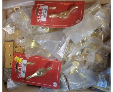A box of brass sash window fittings